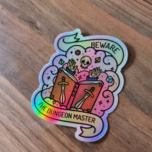Load image into Gallery viewer, holographic dungeon master sticker!
